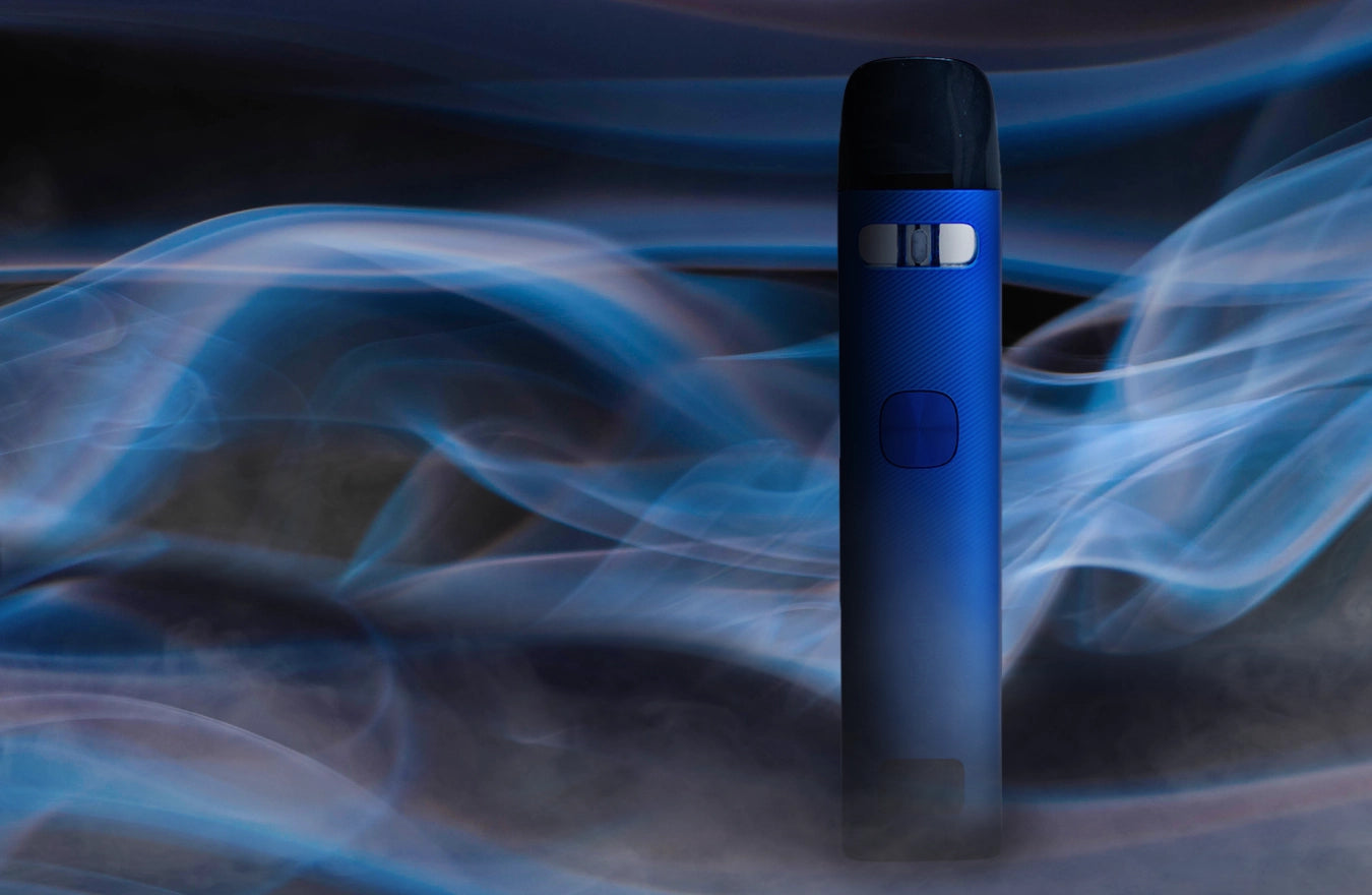 Blue UWell Caliburn G3 with smoke surrounding it on dark screen