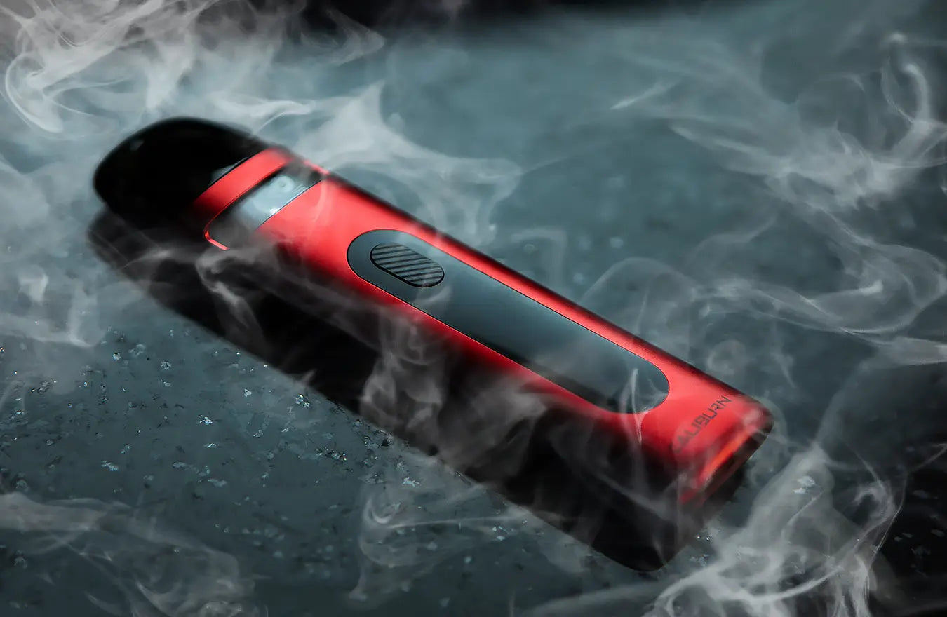 red uwell caliburn x on a table with smoky background