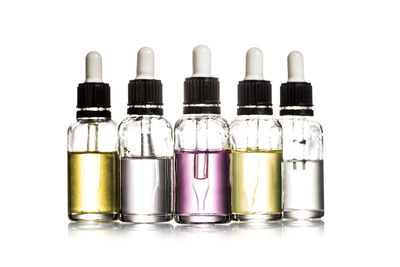 Generic bottles of e-liquid on white background