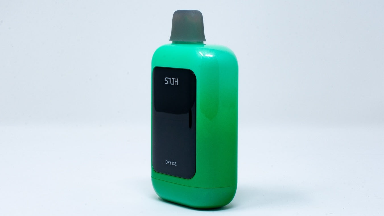 Close-up of green STLTH Vision disposable vape device