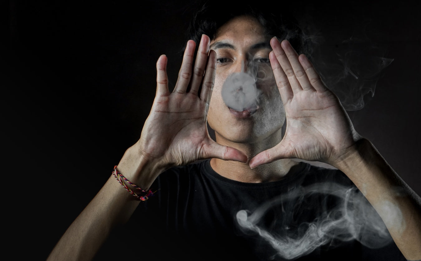 Man releasing ball of vapour gently during ghost vaping