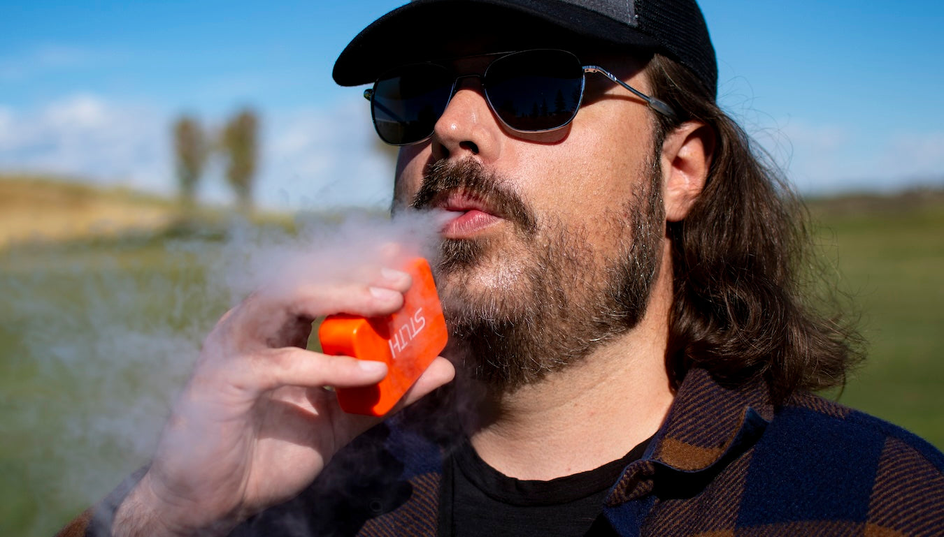 Man using a STLTH Titan Pro disposable device