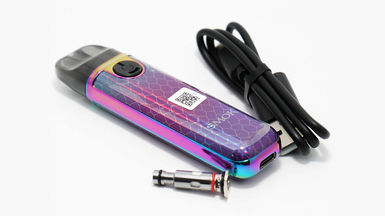 SMOK Novo 4 Mini Pod Vape Device with charge cable and coil nearby